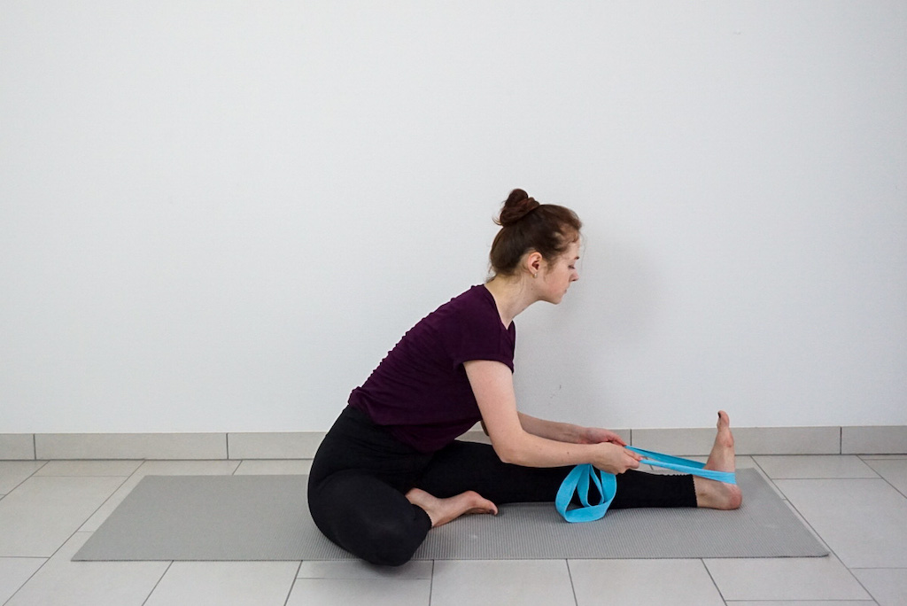 head to knee pose with yoga strap