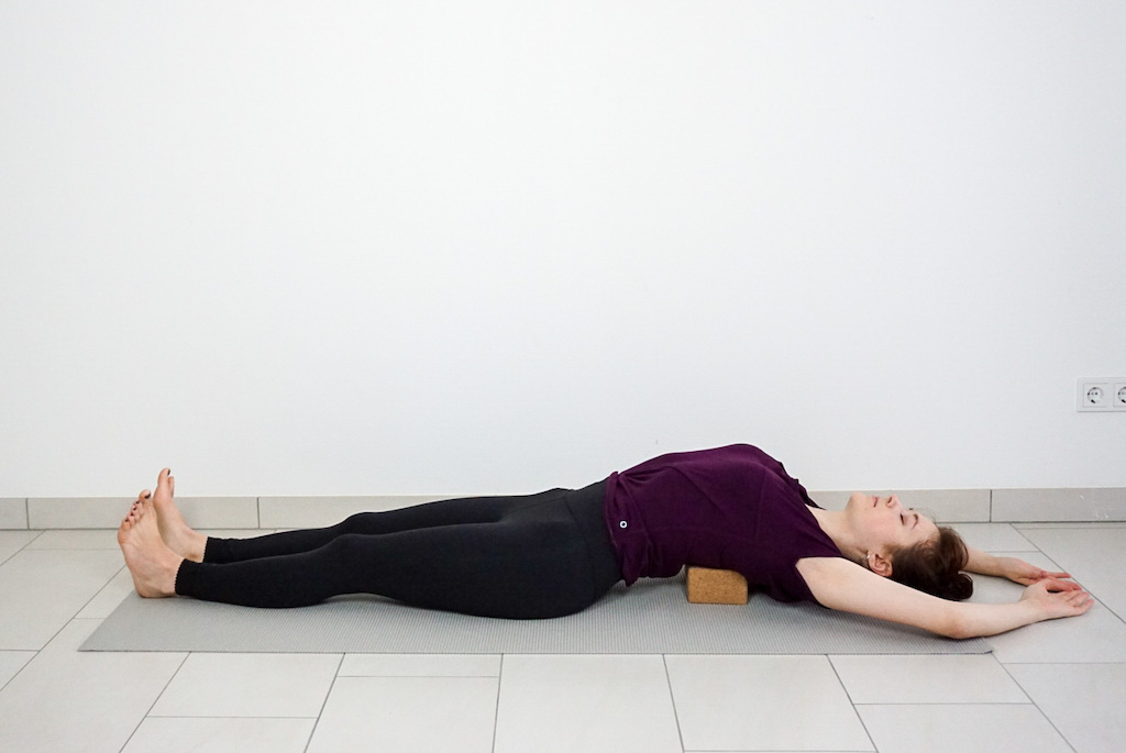 supported fish pose with yoga blocks