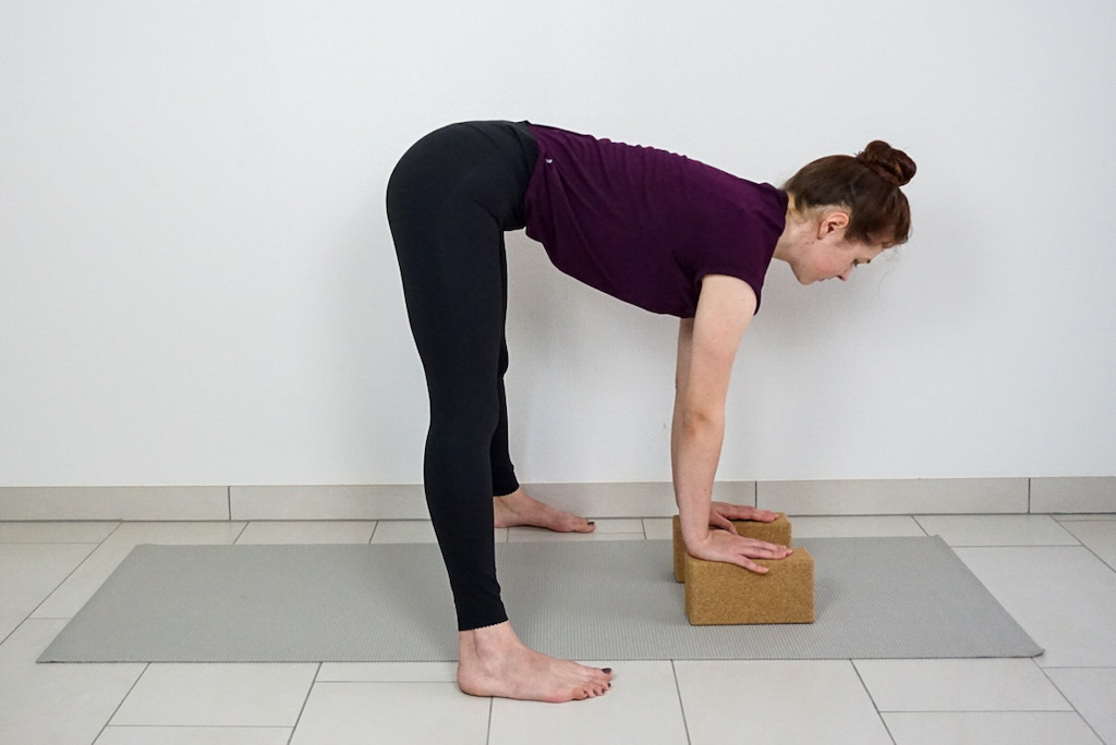 wide legged forward fold with yoga blocks