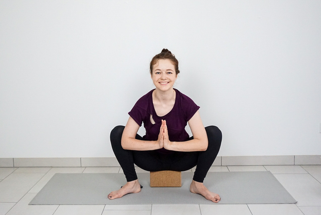 yoga squat for beginners with yoga block