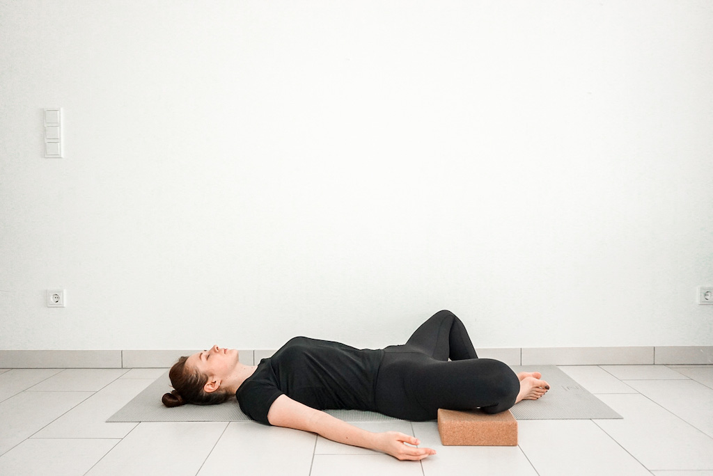 reclined bound angle pose with yoga blocks