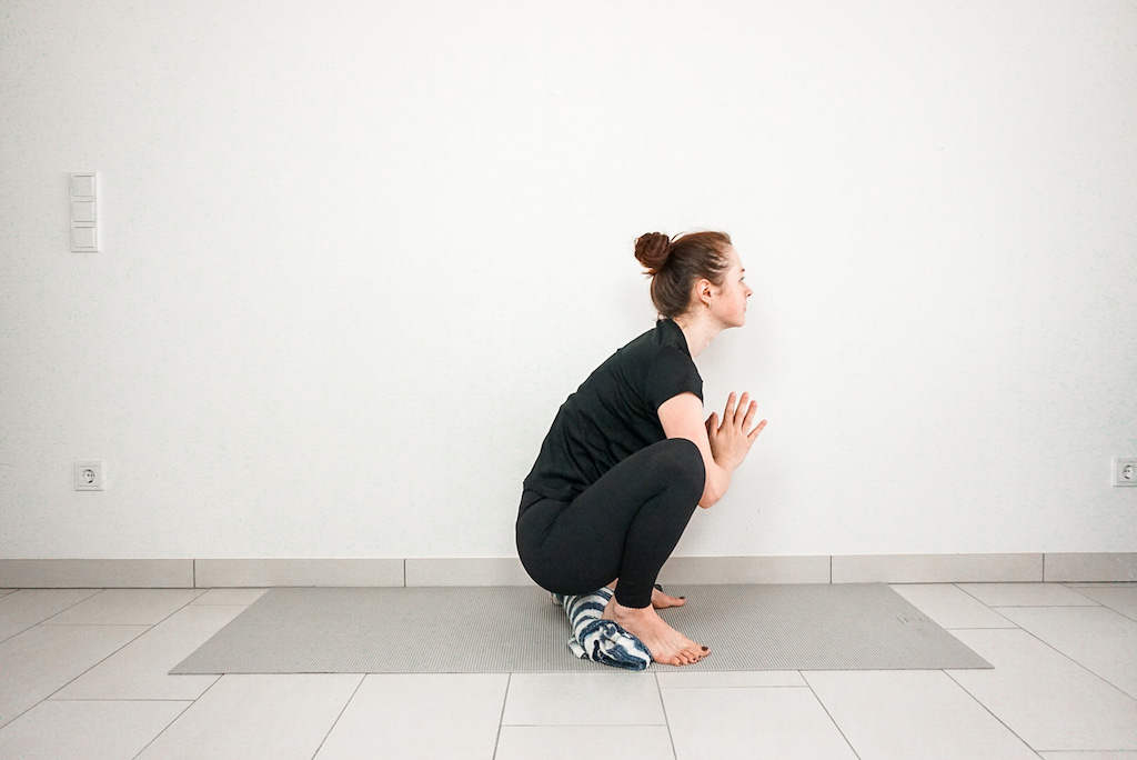 yoga squat for beginners with blanker