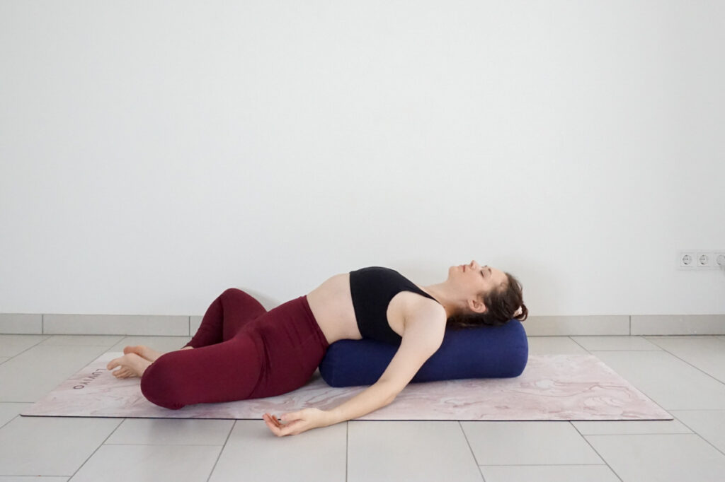 reclined bound angle with yoga bolster